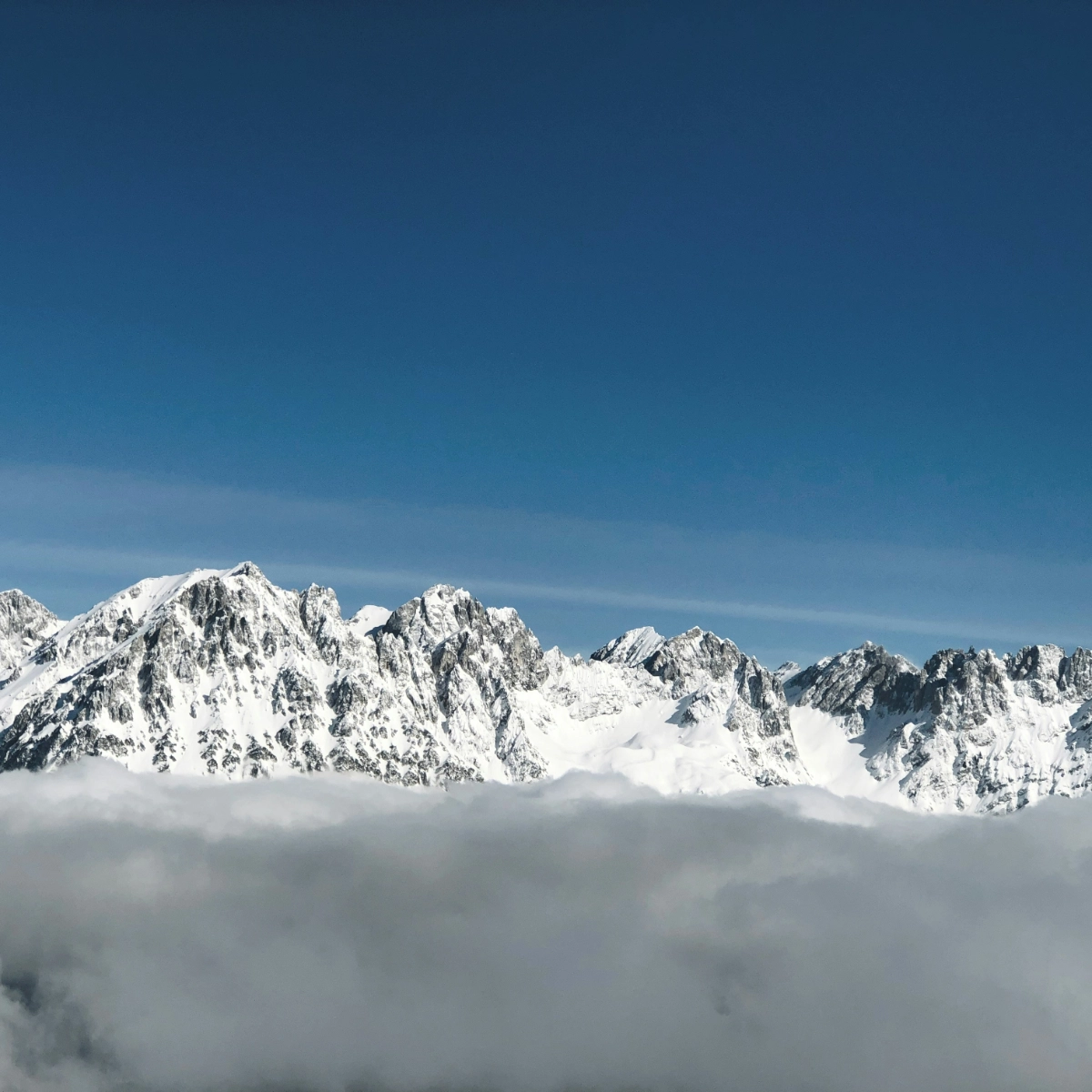 A photo of snow capped mountains in the distance